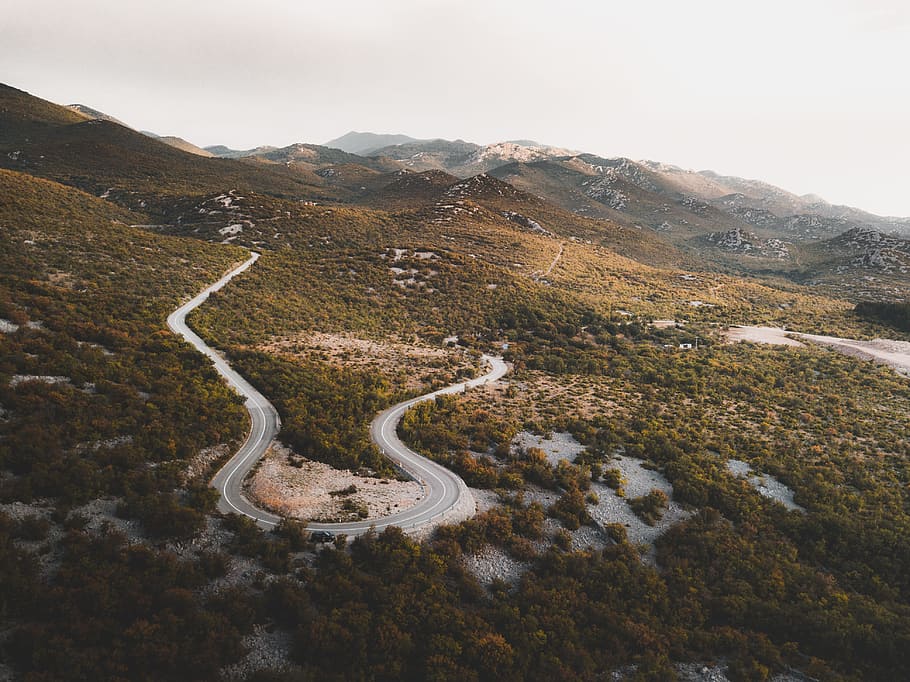 green field with road, mountain, curve, bend, aerial, from above HD wallpaper