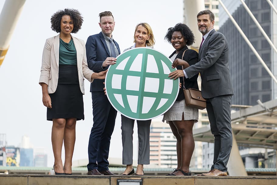 Five People Standing While Holding Green Globe Art, achievement
