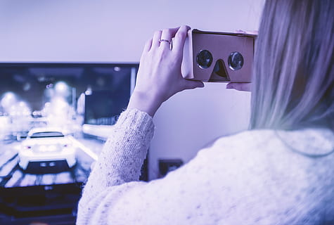 Girl uses cardboard for virtual reality at home, technology, photography themes HD wallpaper
