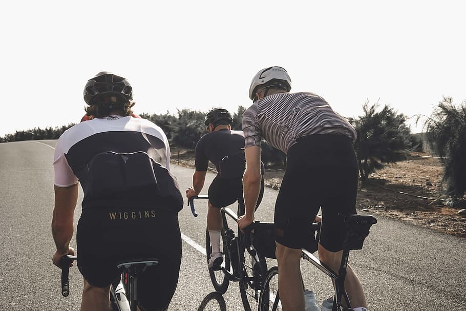 three men biking on road during daytime, person, human, apparel, HD wallpaper