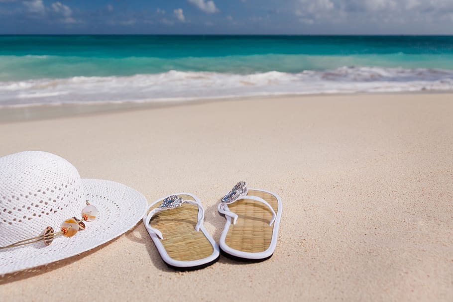 White Hat Beside White Flip Flops Near Short, beach, coast, flip-flops HD wallpaper