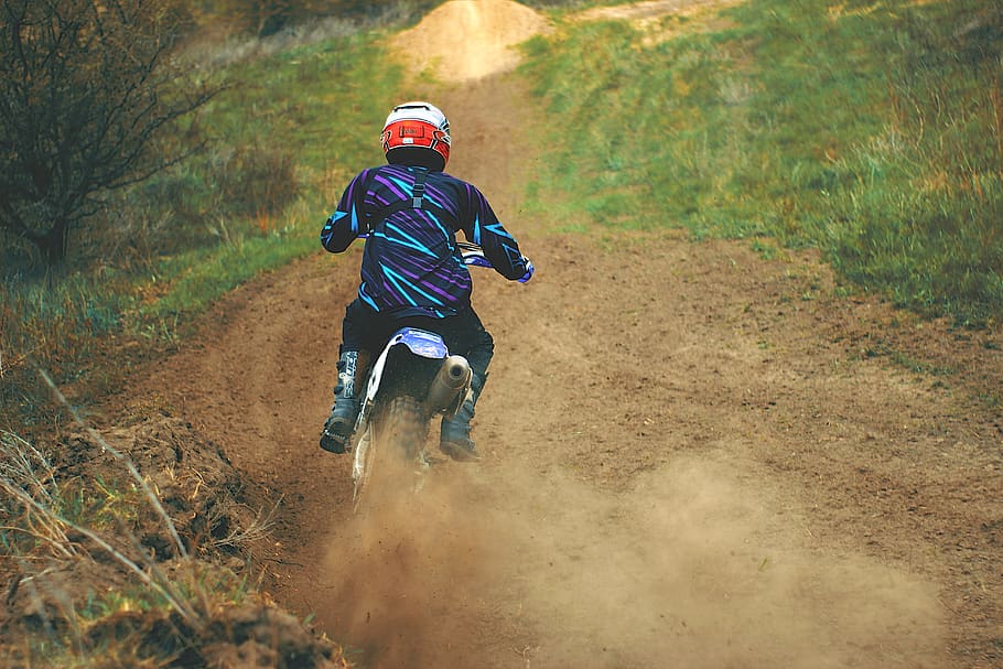 Man Riding Motocross Dirt Bike on Dirt Road, action, adult, adventure