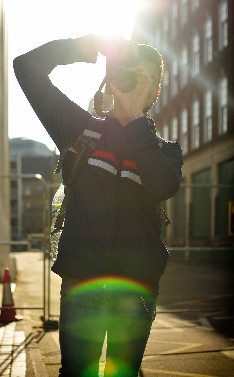 man holding DSLR camera, person, rainbow, nature, outdoors, sky HD wallpaper