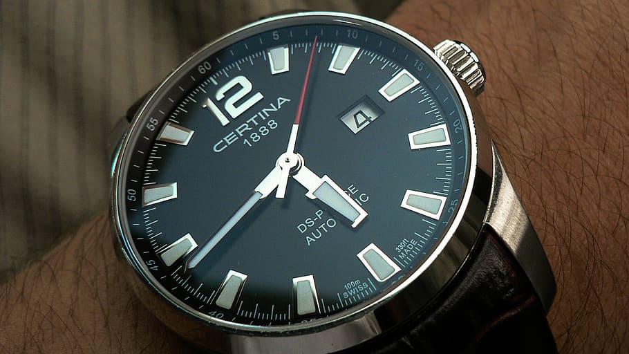 Person Wearing Round Silver-colored Certina Watch Displaying 5:44