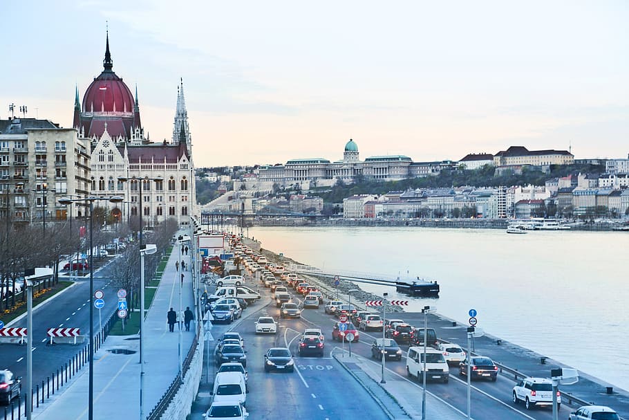Side View Of Hungarian Parliament Building With Cars On Road in Budapest