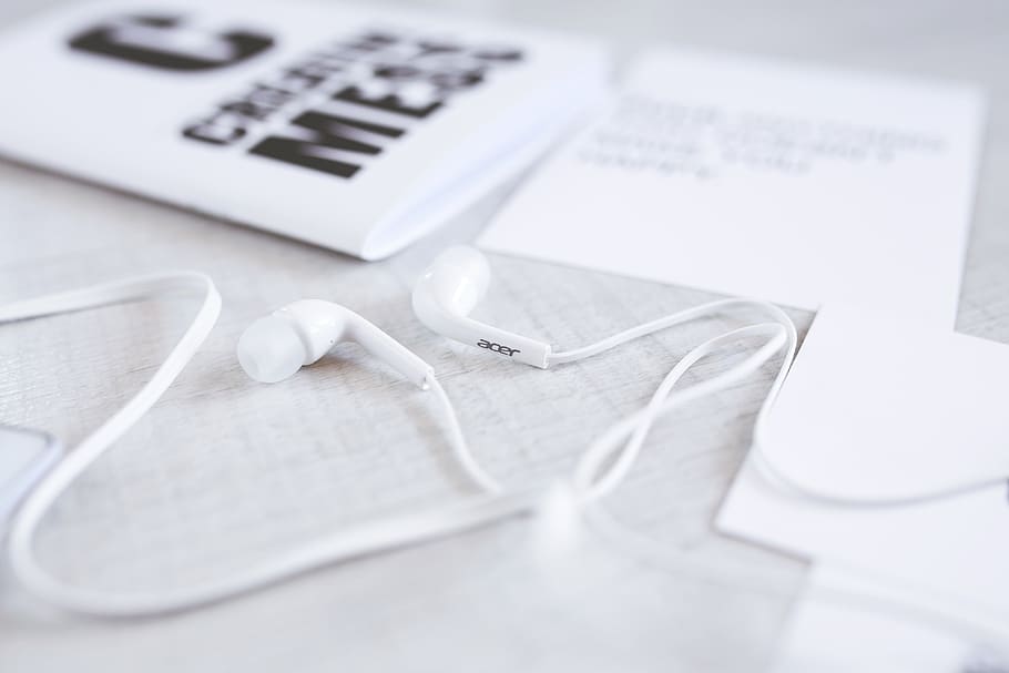 White and modern earphones on a desk, acer, digital, headphones, HD wallpaper
