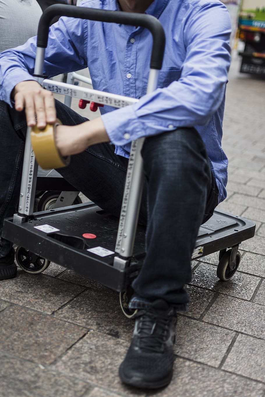 man sitting on cart, shoe, clothing, apparel, footwear, person HD wallpaper