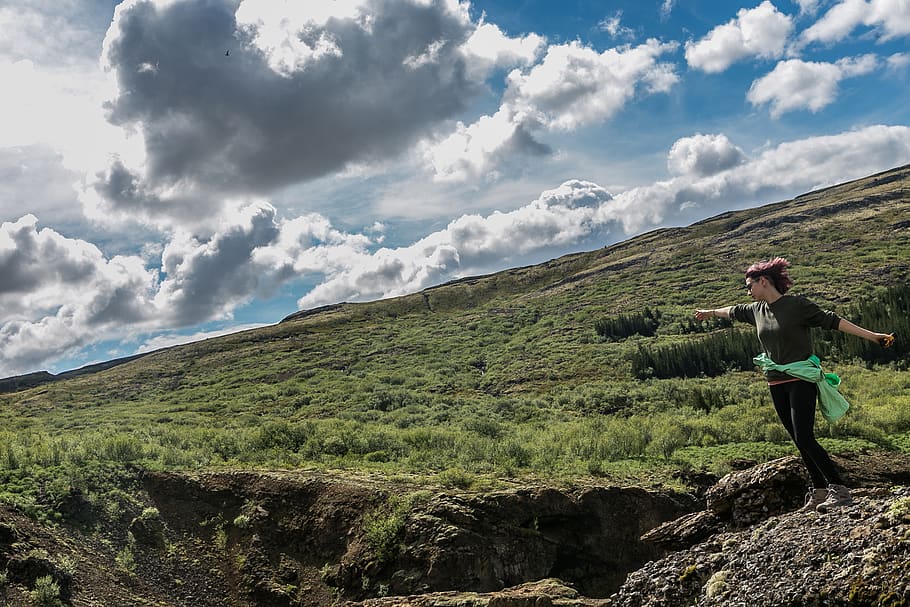 Woman Trekking on Green Grass Covered Hill, adventure, clouds HD wallpaper