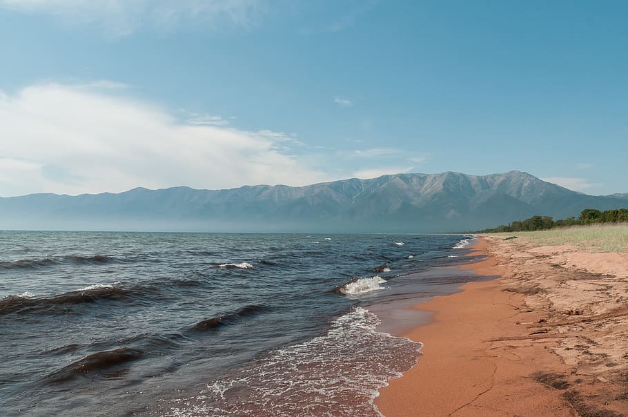 seashore during daytime, mountain, water, sky, land, beauty in nature HD wallpaper