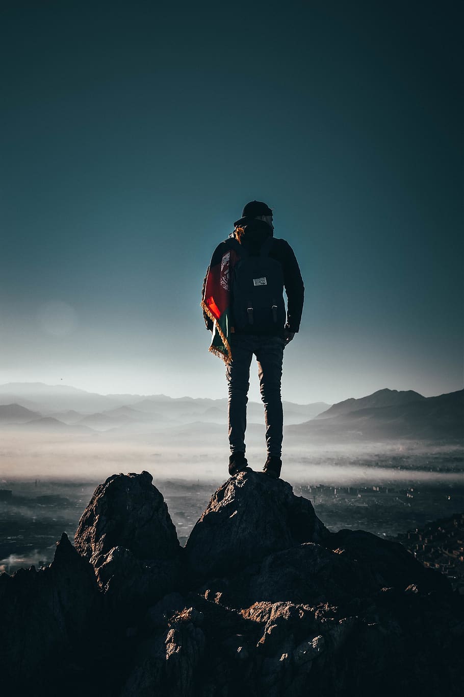 Man Carrying Backpack Standing on Rock Formation, adventure, cap HD wallpaper