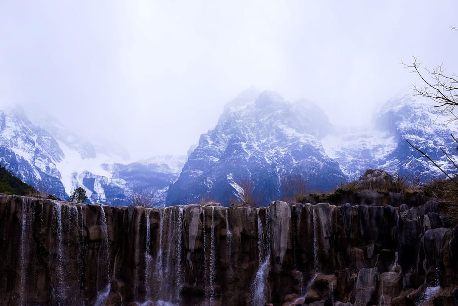 snow covered mountains under grey clouds, nature, outdoors, ice HD wallpaper