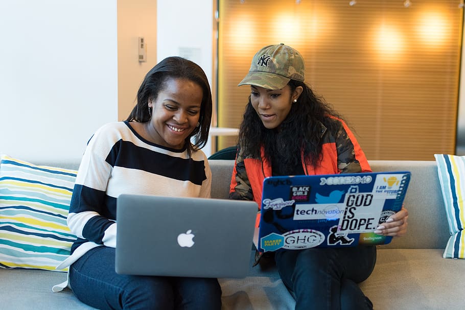 Two Women Holding Laptop, computers, developer, development, friends HD wallpaper