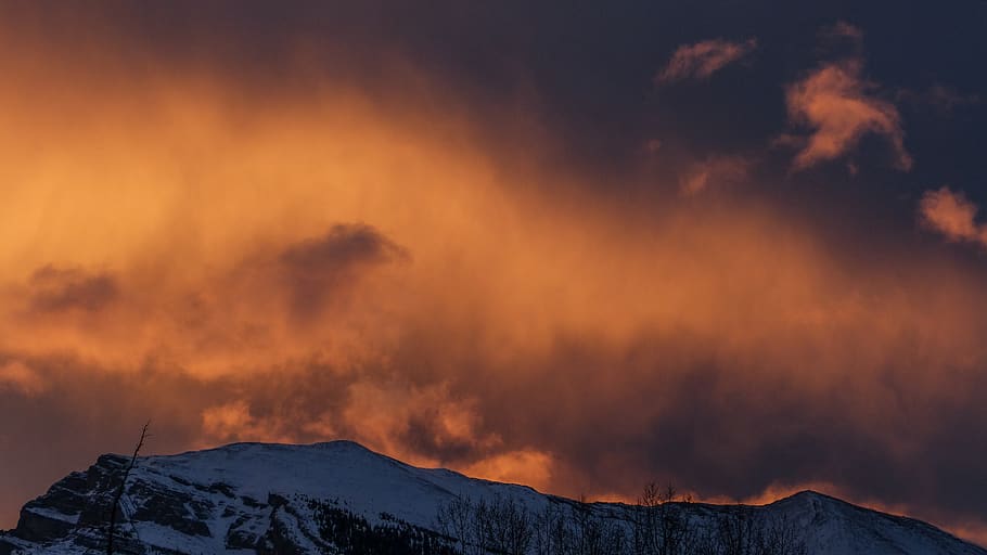 snowy mountain under cloudy sky during sunset, nature, outdoors HD wallpaper