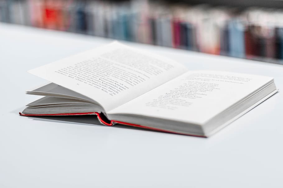 opened book on white surface, publication, education, close-up HD wallpaper