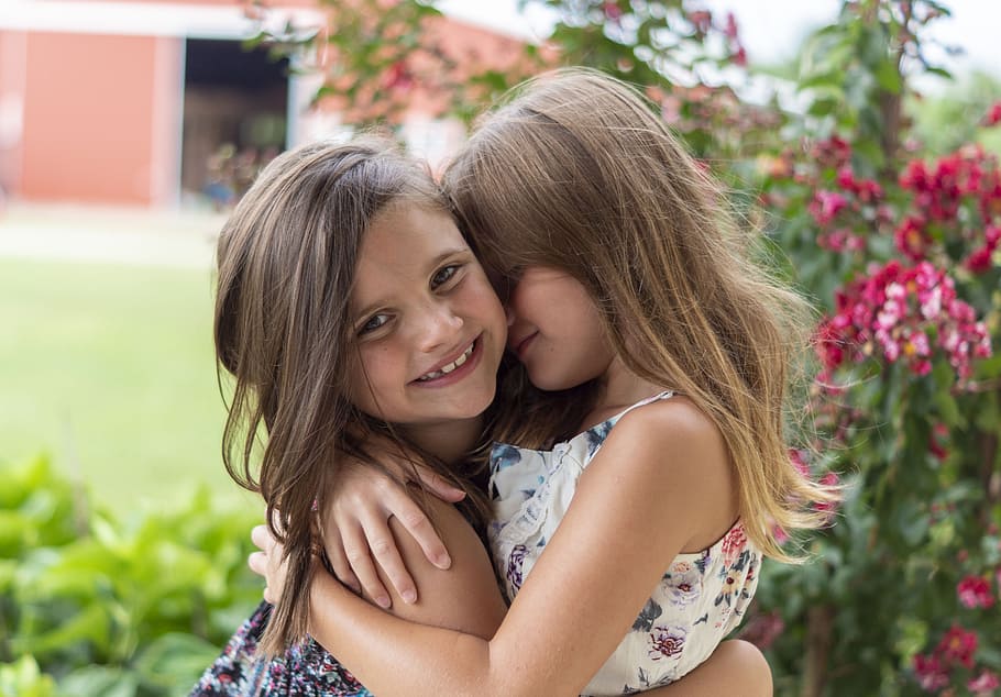 Close-Up Photo of Two Little Girls Hugging Each Other, beautiful