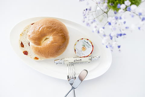 bread on white plate, food, bagel, fork, flower, knife, dish HD wallpaper